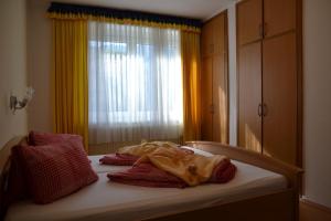 Ένα ή περισσότερα κρεβάτια σε δωμάτιο στο Ferienwohnungen Miklautsch