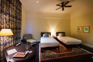 Voodi või voodid majutusasutuse Galle Face Hotel toas