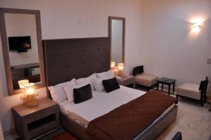 Postel nebo postele na pokoji v ubytování Solo Victoria Hotel