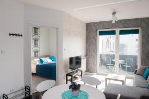 Posteľ alebo postele v izbe v ubytovaní Apartament Winogrady Hawelańska