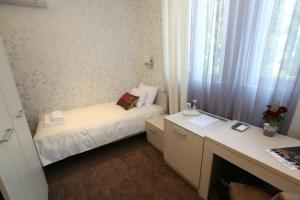 A bed or beds in a room at Konačište Grad B&B