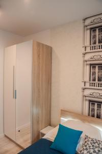 Posteľ alebo postele v izbe v ubytovaní Apartament Winogrady Hawelańska