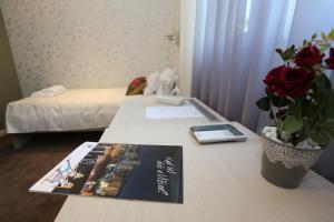 A bed or beds in a room at Konačište Grad B&B