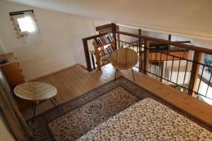 an overhead view of a room with two chairs and a rug at Au Pied du Château in Gréolières les Neiges