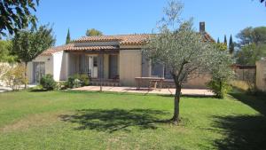 a small tree in the yard of a house at Studio A Grans in Grans