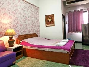 Ένα ή περισσότερα κρεβάτια σε δωμάτιο στο Wiang Inn Mansion +12 φωτογραφίες