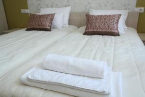 A bed or beds in a room at Konačište Grad B&B