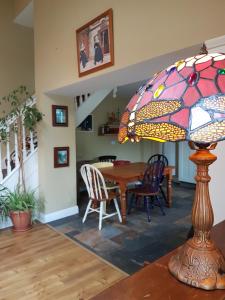 a stained glass lamp sitting on top of a table at Glenbower House in Cork +16 photos