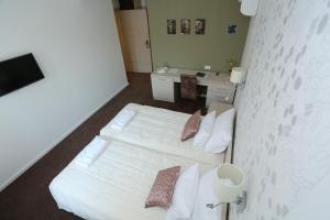 A bed or beds in a room at Konačište Grad B&B