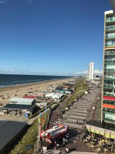 an aerial view of a beach with a fire truck at Evy's place in Zandvoort