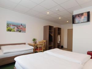 Postel nebo postele na pokoji v ubytování WinBudget "bed&breakfast"