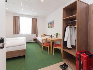 Postel nebo postele na pokoji v ubytování WinBudget "bed&breakfast"