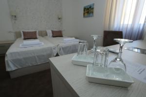 A bed or beds in a room at Konačište Grad B&B