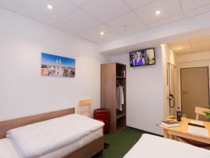 TV a/nebo společenská místnost v ubytování WinBudget "bed&breakfast"