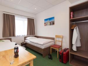 Postel nebo postele na pokoji v ubytování WinBudget "bed&breakfast"