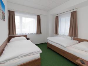 Postel nebo postele na pokoji v ubytování WinBudget "bed&breakfast"