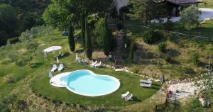 an aerial view of a swimming pool in a yard at Agriturismo Santa Giusta in Poggio San Lorenzo