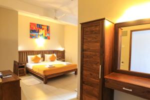 A bed or beds in a room at Port View City Hotel