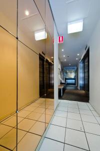 a hallway with a door leading to a bathroom at City Square Motel in Melbourne