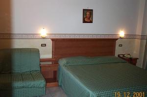 Postel nebo postele na pokoji v ubytování Hotel Lento