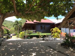 a house in the middle of a street at No Name Bungalow Haad Yao in Haad Yao +103 photos
