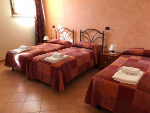 Letto o letti in una camera di Agriturismo Ai Due Volti