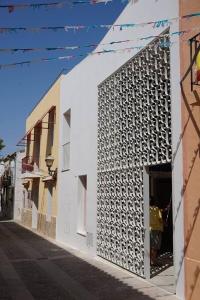 a person standing in a doorway of a building at Hotel Santacreu in Tabarca