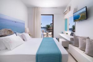Voodi või voodid majutusasutuse Sun Rise Hotel toas