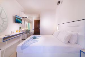 Voodi või voodid majutusasutuse Sun Rise Hotel toas