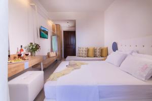 Voodi või voodid majutusasutuse Sun Rise Hotel toas