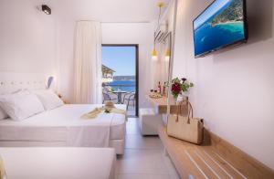Voodi või voodid majutusasutuse Sun Rise Hotel toas
