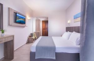 Voodi või voodid majutusasutuse Sun Rise Hotel toas
