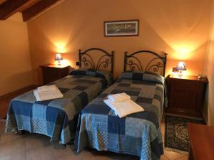 Letto o letti in una camera di Agriturismo Ai Due Volti