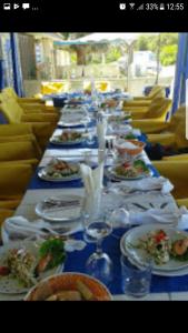 a long table with plates of food on it at Issablanca in Oualidia