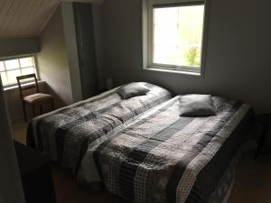 Tempat tidur dalam kamar di Forsa Gård Attic