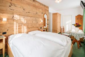 Łóżko lub łóżka w pokoju w obiekcie Hotel Oasi