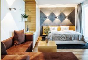 Postel nebo postele na pokoji v ubytování Seevital Hotel & SPA - Ihr 4 Sterne Superior Hideaway direkt am See
