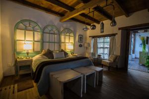 Säng eller sängar i ett rum på Mexicanos 10 CasaVieja