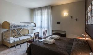 Postel nebo postele na pokoji v ubytování Hotel Montebello