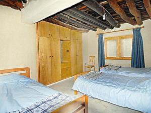 Säng eller sängar i ett rum på El Achkar Guesthouse