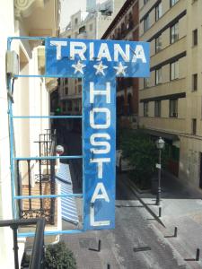 a blue sign that says traniosaosa on a street at Hostal Triana in Madrid