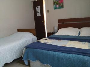 Hostal Caleta Abarca客房内的一张或多张床位