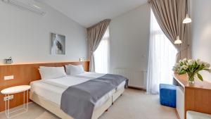 Postel nebo postele na pokoji v ubytování Villa 21 by Victus