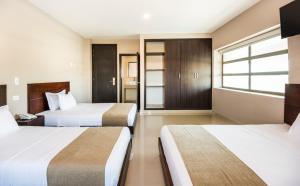 Postel nebo postele na pokoji v ubytování Ribai Hotels - Barranquilla