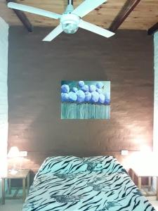 Una cama o camas en una habitación de Hotel de Campo El Rebenque