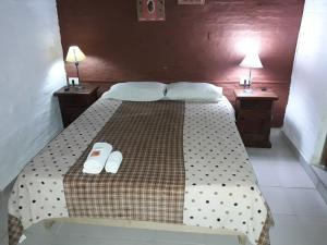 Una cama o camas en una habitación de Hotel de Campo El Rebenque