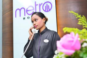 Členové personálu v ubytování Metro Hotel Bukit Bintang