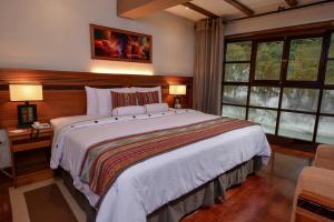 Cama ou camas em um quarto em Casa del Sol Machupicchu
