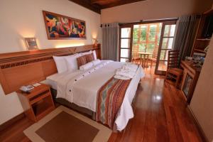 Cama ou camas em um quarto em Casa del Sol Machupicchu