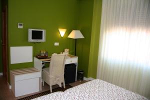 TV a/nebo společenská místnost v ubytování Hostal Paris
